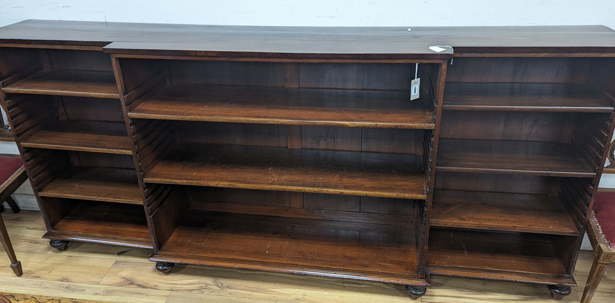 A Victorian mahogany breakfront open bookcase, length 229cm, depth 39.5cm, height 104cm